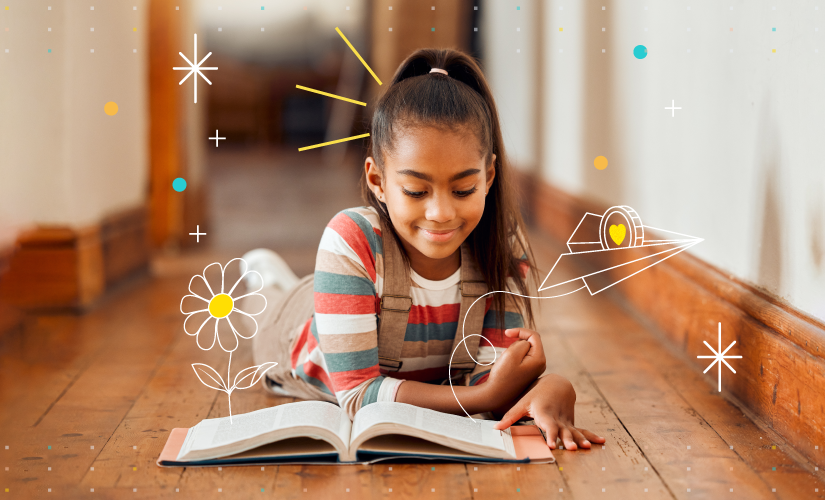 happy child reading a book as part of early literacy development
