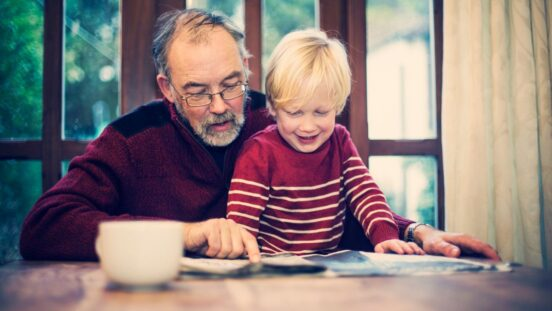 toddler pointing at picture book during language explosion reading milestone stage