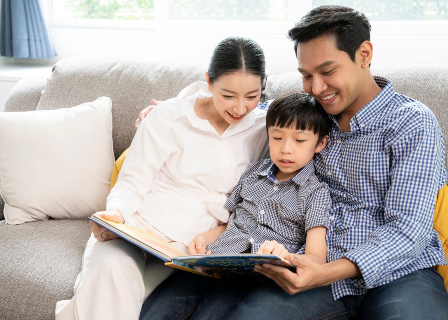 parent supporting phonics and early reading at home with young child