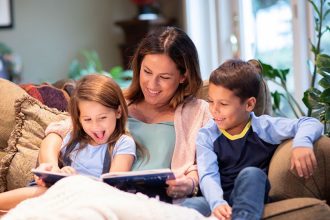 parent reading with young child to support reading milestones by age