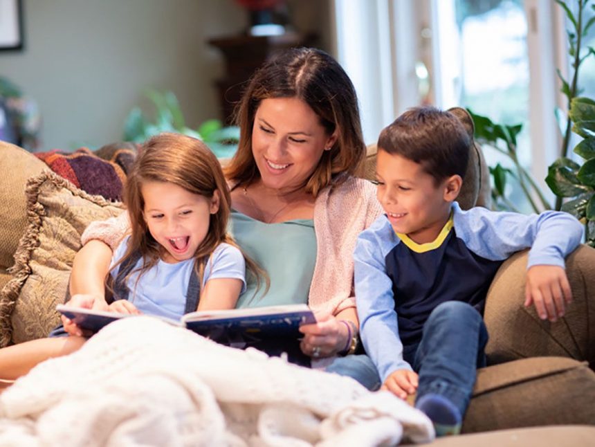parent reading with young child to support reading milestones by age