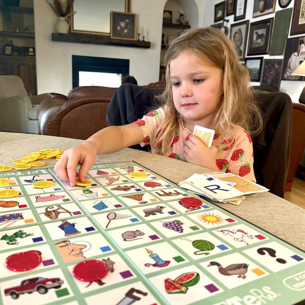 children playing fun sight word card game at home as reading activity