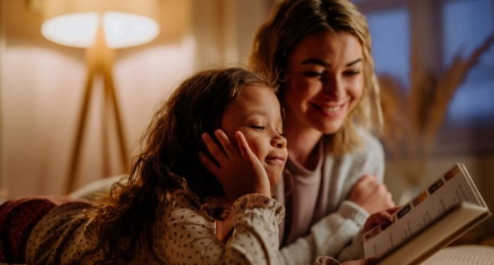 parent and child reading picture book together
