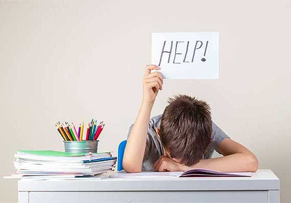 child struggling with reading showing signs of reading avoidance and skill gap