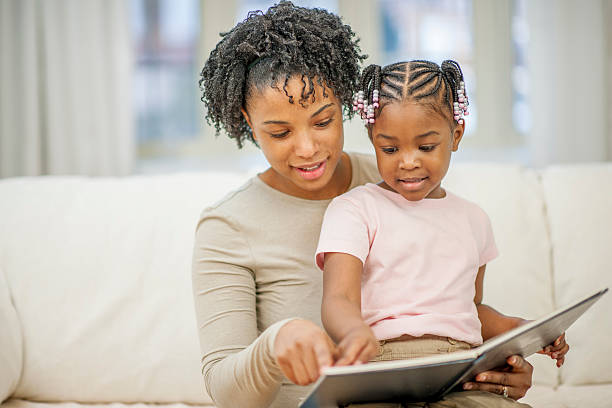 parent and child rereading the same favorite storybook together