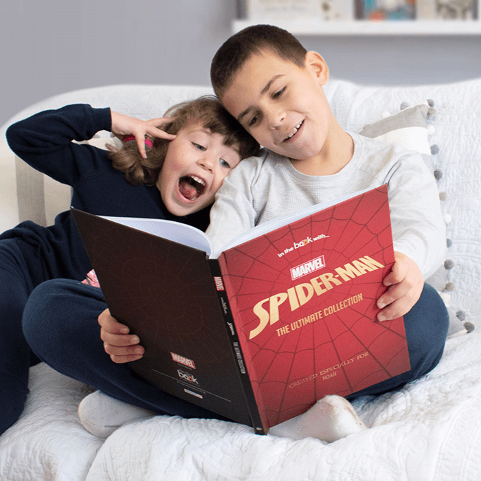 child reading a Spider-Man graphic novel