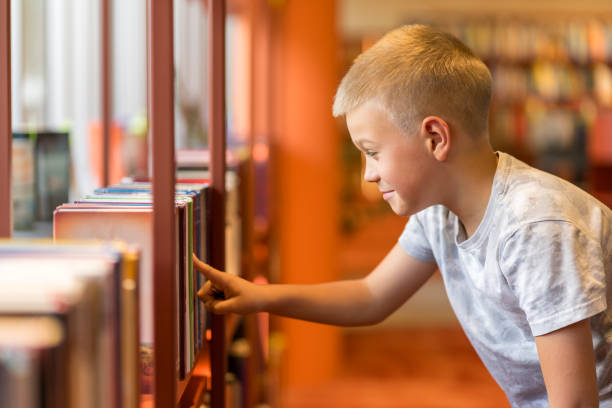 Child choosing books for reading aloud