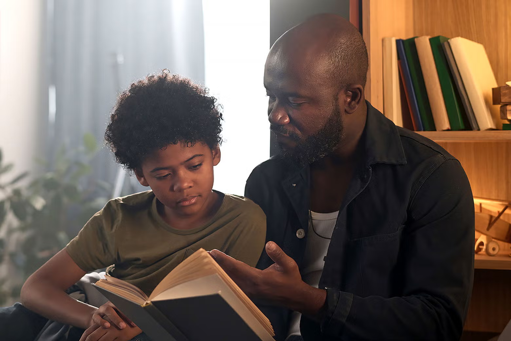 Parent reading aloud with an older child
