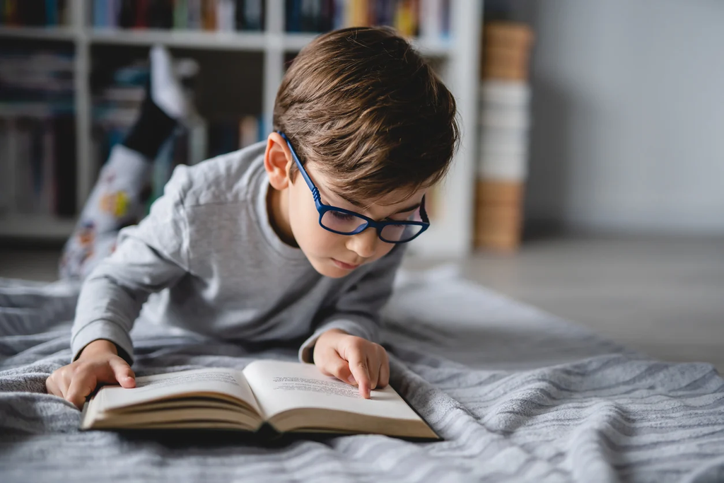 Child looking for clues in a book to answer questions