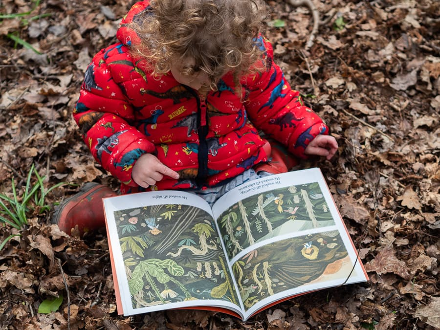 Child connecting a nonfiction book to real life