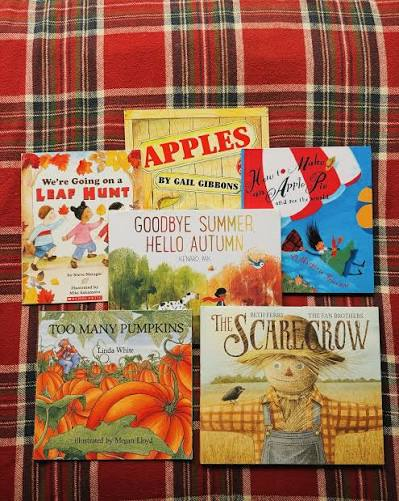 Autumn children's books with pumpkins and colorful leaves