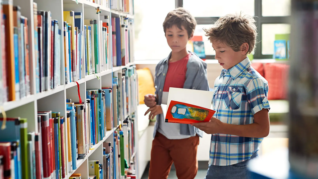 Child choosing an autumn book to read
