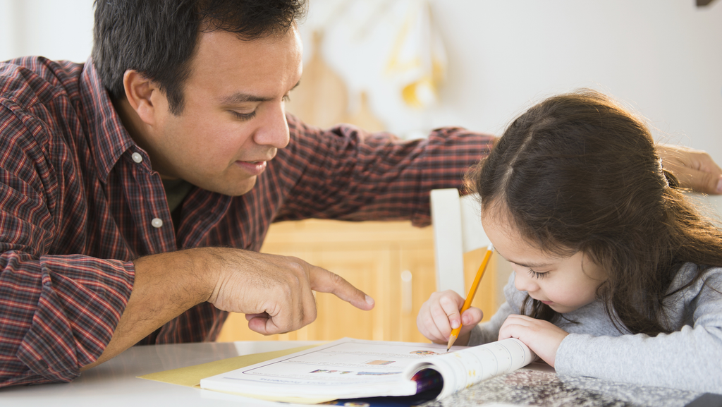 Parent and child discussing a reading assignment