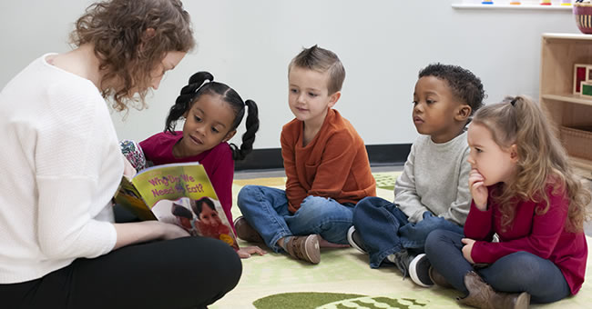 Child thinking about a story while reading