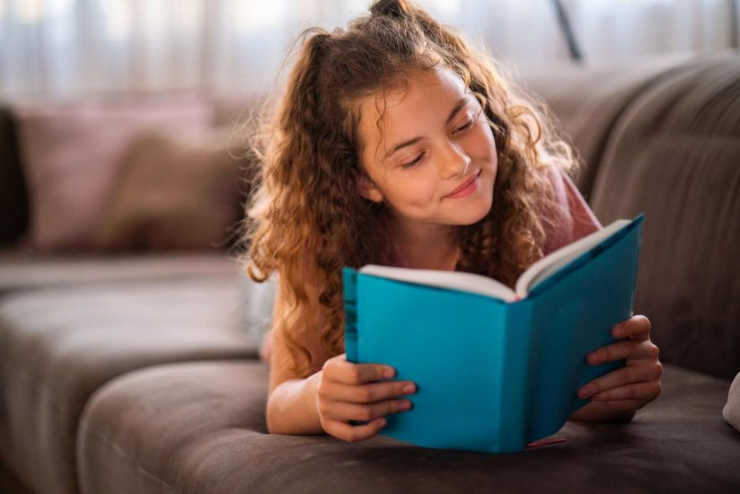 Child enjoying reading a book