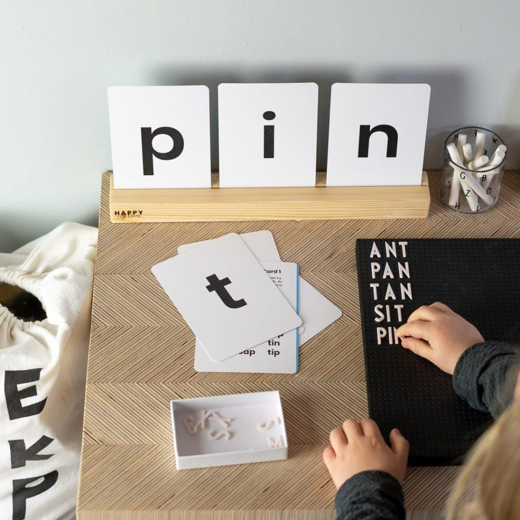 Letter tiles and word flashcards used to practice phonics and sight words