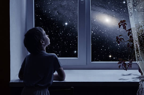 Child looking at stars after reading about space