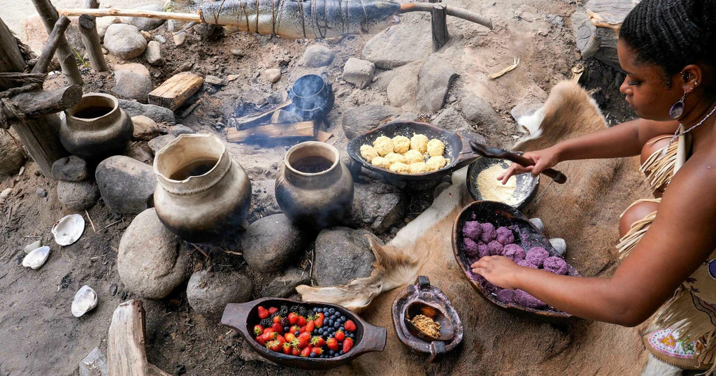 Wampanoag food preparation demonstrated at an outdoor cooking fire