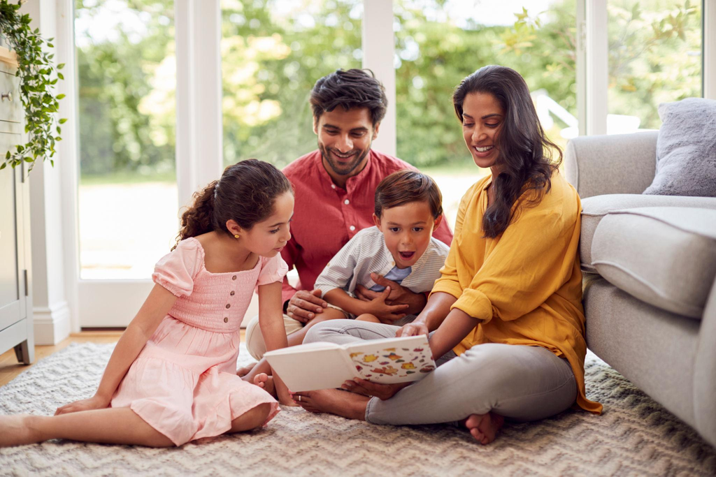 Family reading a Thanksgiving History Book together at home