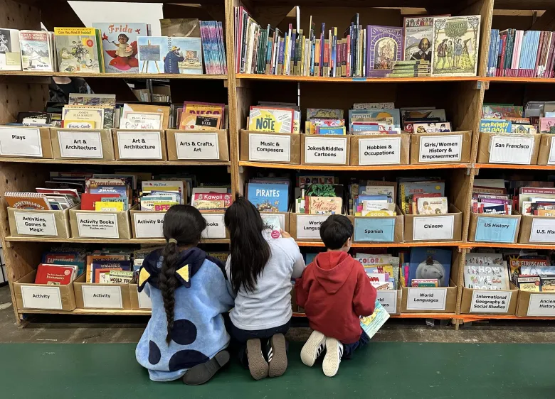 Children choosing a book to read