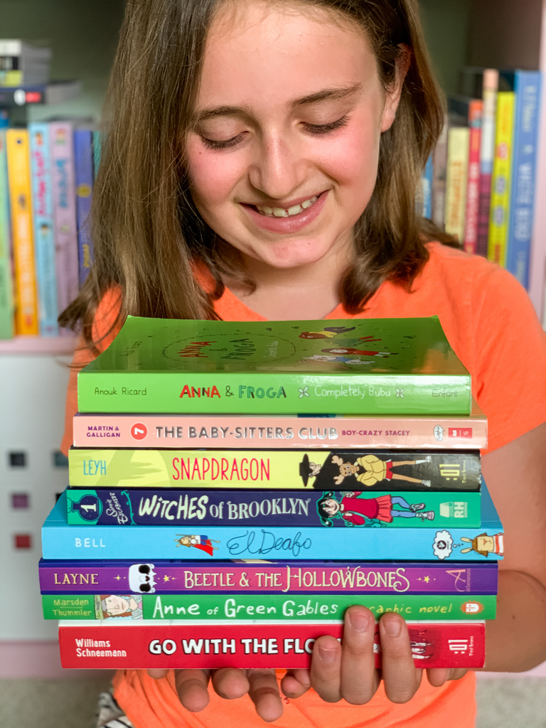 Books for kids who don't like reading: child reading a graphic novel